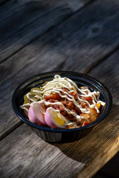 bowl of dressing, meat and veggies