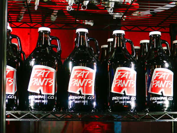 Several Fat Pants Branded Growlers