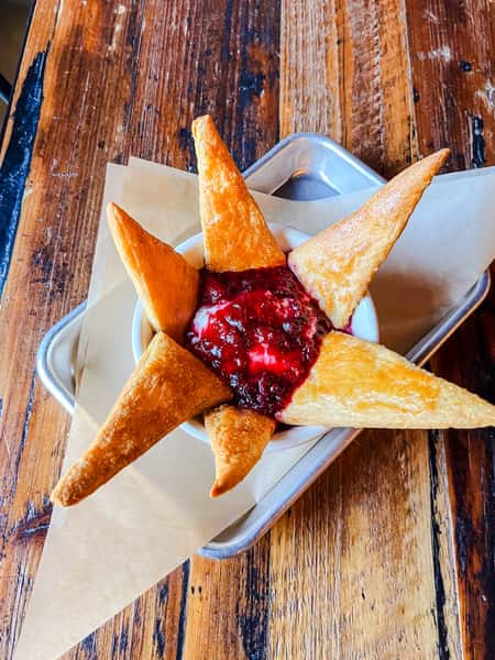 Oven-roasted brie, sweet and tangy mixed berry compote, wrapped in a flaky, buttery puff pastry