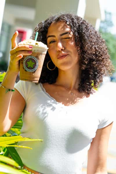 Girl holding a smoothie