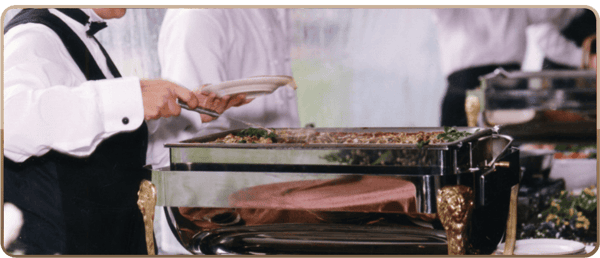 person getting food from tray