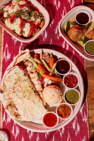Tandoori Chicken Poutine, Samosas, Bread Service
