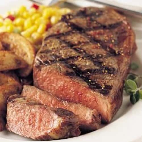 A 12 oz. NY Strip Charbroiled to your temperature with a light mix of Montreal Steak Seasoning.
