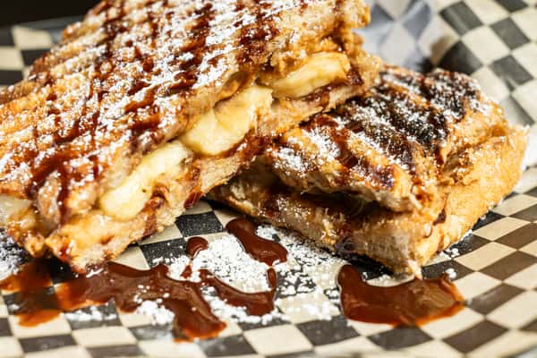 Peanut Butter And Banana Panini on checkered paper
