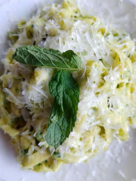 spaghetti squash topped with basil and parmesan cheese