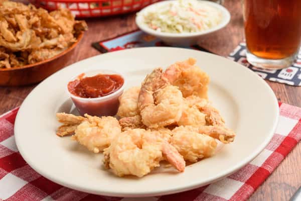 Fried Shrimp on a plate with dipping sauce
