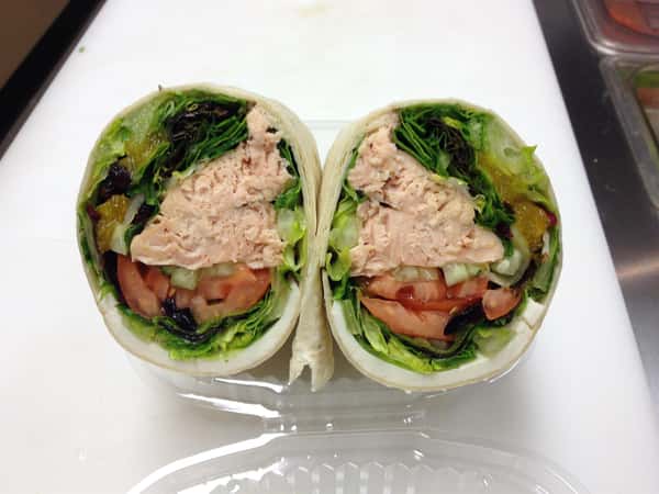 Whole wheat wrap with turkey, lettuce, tomato, and cheese