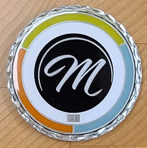 Photo of the Signature Maynard's Challenge Coin. Coin Holders can recieve discounts and exclusive access to private dining events held at the restaurant. Coin must be shown to recieve discounts.
