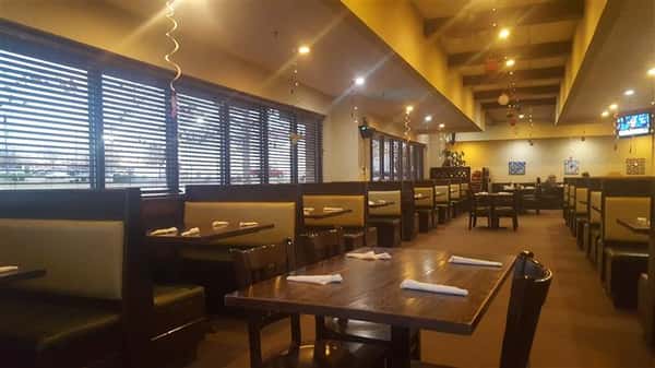Dining area of the establishment with windows to the sides