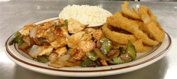 Chicken, Onion rings, and stir fried vegetables served along side rice.