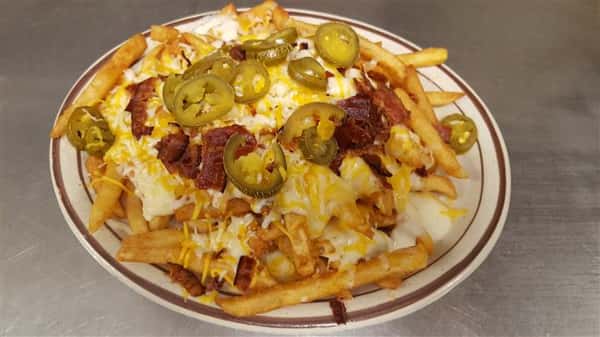 French fries topped with Jalapenos and queso sauce