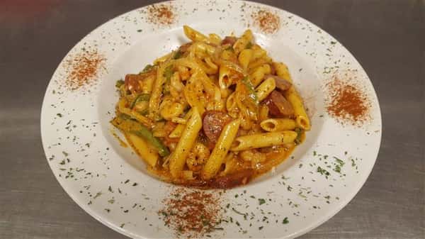 Rigate pasta served with chopped sausage and veggies
