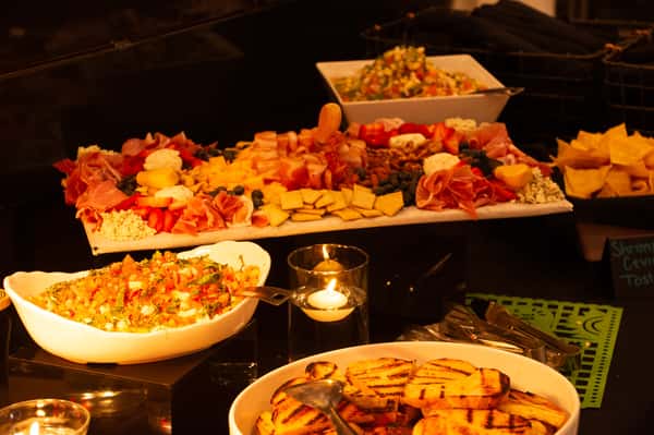 Food and candles on a table at a group events