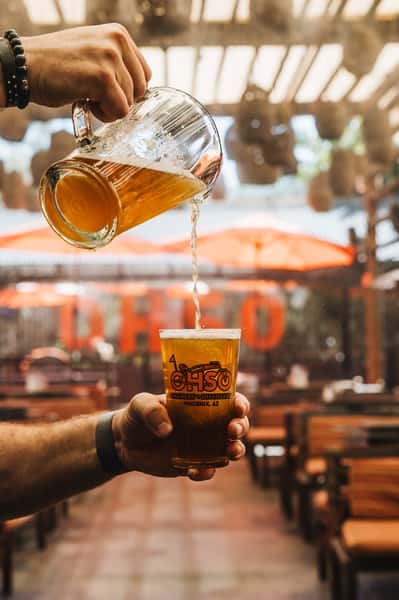 pouring beer from pitcher