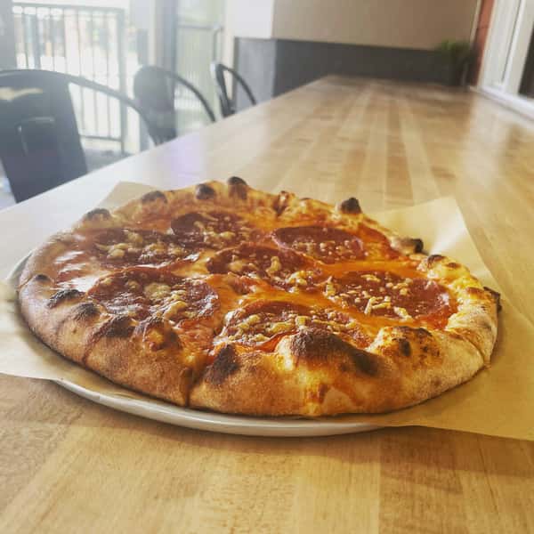 Pizza on table inside restaurant