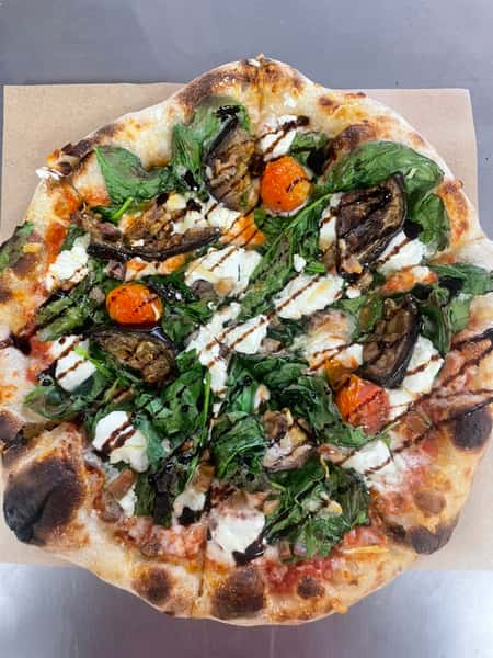 Pizza with vegetable toppings