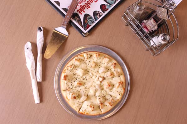 pizza pie with utensils and menu
