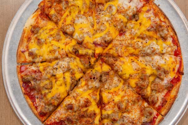 Bacon cheeseburger pizza topped with ground beef, bacon, and melted cheese at The Gaslight Pizza & Grill in Huntingburg, Indiana