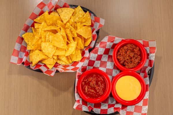 Crispy tortilla chips with queso, salsa, and seasoned meat dip at The Gaslight Pizza & Grill in Huntingburg, Indiana