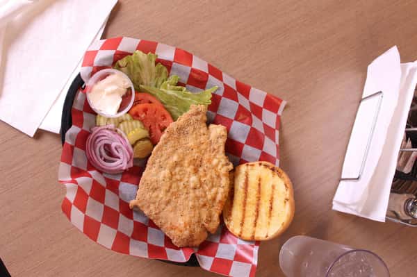 fried chicken sandwich with water