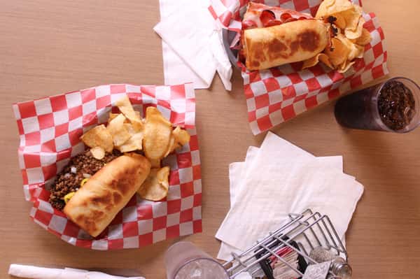 two sandwich basket with chips and cola