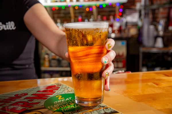 Cold draft beer being served at the bar inside The Gaslight Pizza & Grill in Huntingburg, Indiana