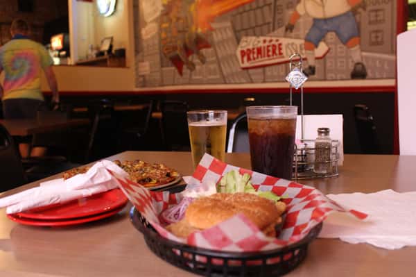 fried chicken sandwich with beer and cola