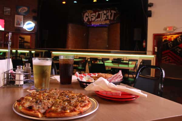 pizza pie with cola and beer with fried chicken sandwich