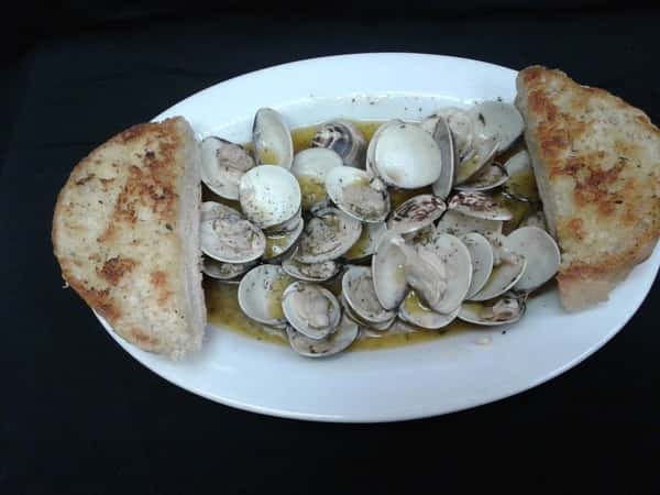 Clams sauteed in garlic butter and served with garlic bread.