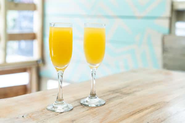 Mimosas in fluted glass