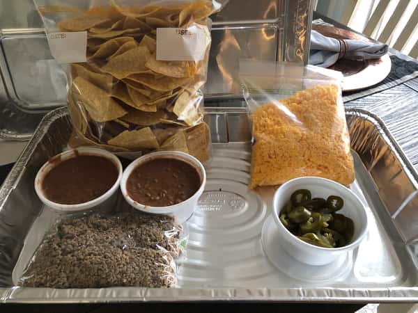 Tortilla chips with salsa, jalapeños, and packaged Mexican rice