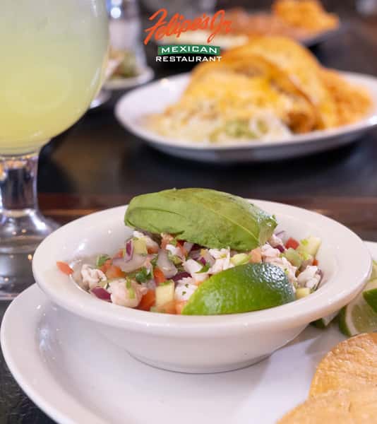 Fresh shrimp ceviche topped with avocado, onions, tomato, and cilantro