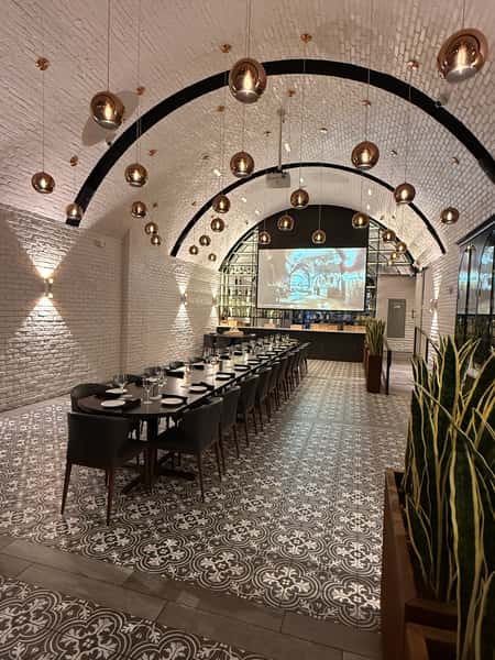 Featuring a single large table setup for 30 people.