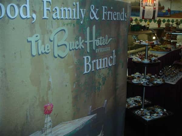 sign that reads the buck hotel