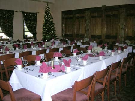 long decorated table with a christmas tree