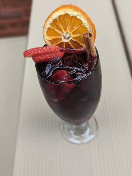cocktail with strawberries and orange slices