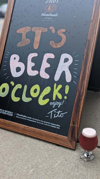 a sign saying its beer o clock