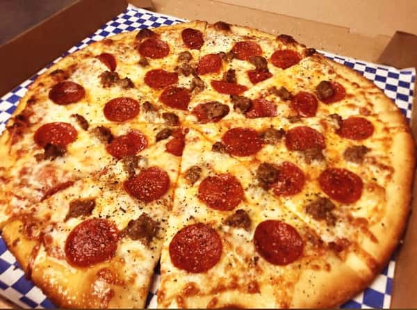 Freshly baked pepperoni and sausage pizza with bubbling mozzarella and seasoned crust, served in a cardboard pizza box for casual Italian takeout dining.