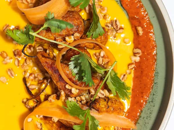 Chef Brown's roasted carrots with Harissa, ginger, cilantro is vergan