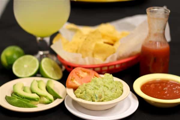 Chips and guacamole with tomato