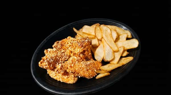 Chicken tenders dusted with Parmesan cheese and a side of potato wedges on a black plate.