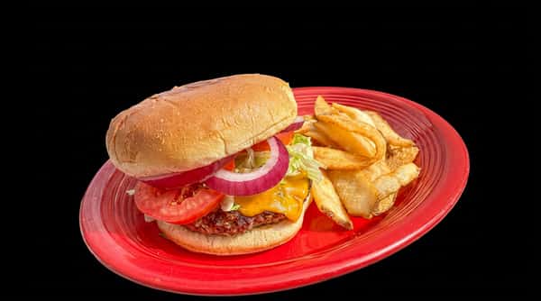 Cheeseburger with lettuce, tomato, and red onion, served with a side of french fries on a red plate.