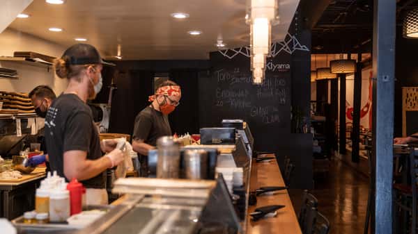staff members at sushi bar