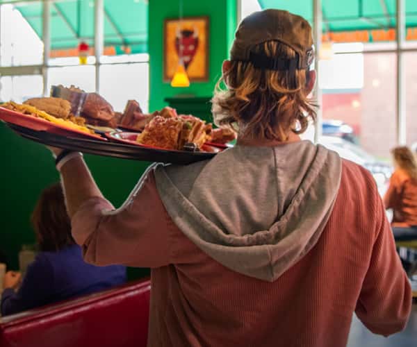 server carrying lunch order