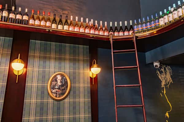 top shelf of wine bottles