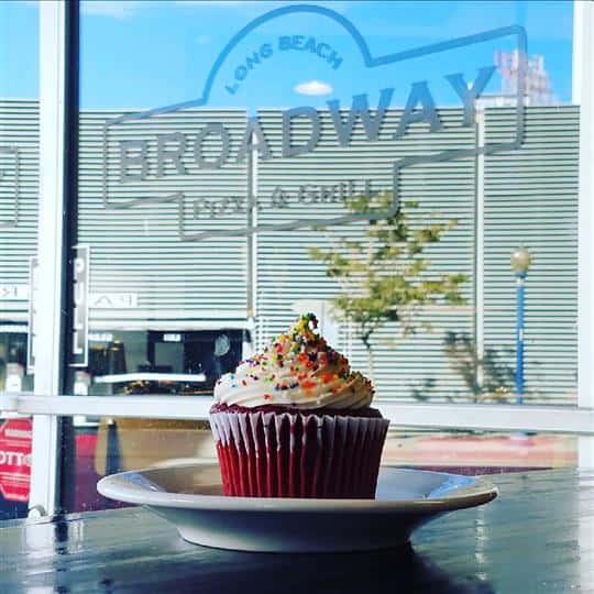 View of cupcake on table in front of front windwo