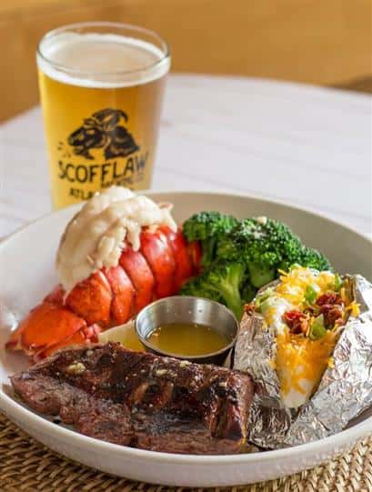 surf and turf plate served with a pint of beer