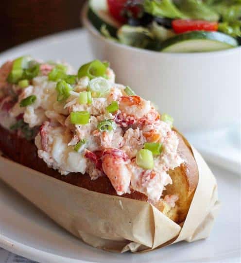 lobster roll with a side salad