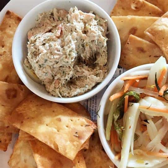 shrimp salad with pita chips and a side of coleslaw