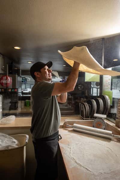 tossing pizza